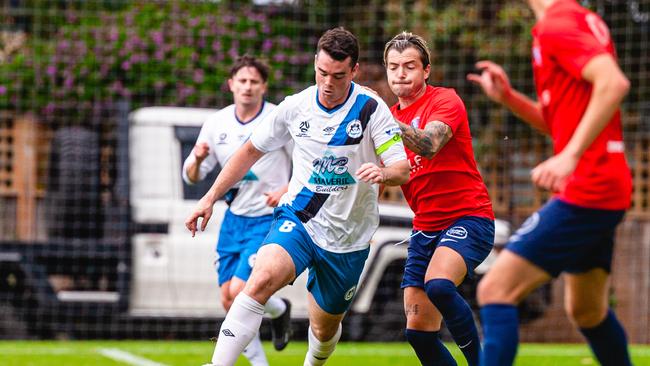 Kobe Kemp of Kingborough Lions and Isky Van Doorne of South Hobart FC during the National Premier Leagues (NPL) football match between South Hobart and Kingborough Lions at South Hobart Oval in Hobart, Saturday 18th March 2023. Picture: Anthony Corke / Solstice Digital