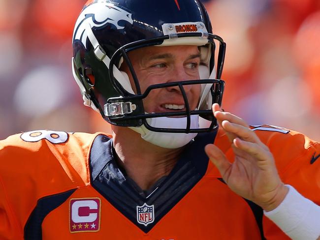 DENVER, CO - OCTOBER 5: Quarterback Peyton Manning #18 of the Denver Broncos passes against the Arizona Cardinals during a game at Sports Authority Field at Mile High on October 5, 2014 in Denver, Colorado. Doug Pensinger/Getty Images/AFP == FOR NEWSPAPERS, INTERNET, TELCOS & TELEVISION USE ONLY ==