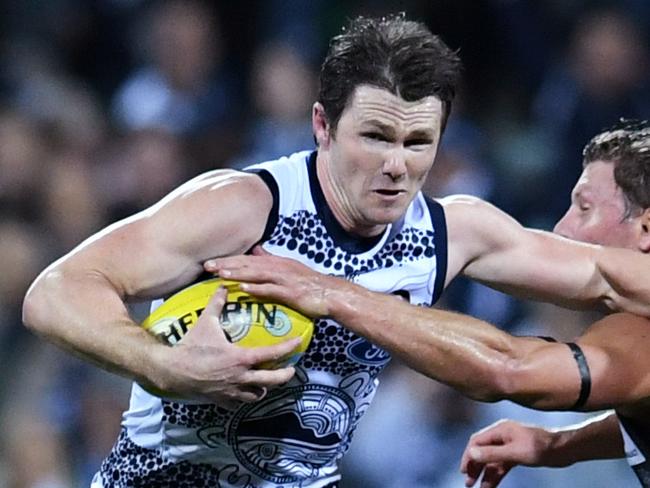 Patrick Dangerfield of the Cats (left) fends off Brad Ebert of the Power during the Round 10 AFL match between the Geelong Cats and Port Adelaide at Simonds Stadium in Melbourne, Thursday, May 25, 2017. (AAP Image/Tracey Nearmy) NO ARCHIVING, EDITORIAL USE ONLY