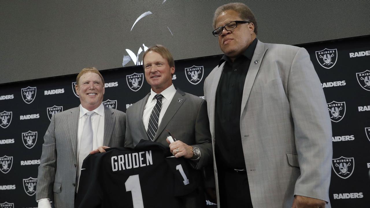 Oakland Raiders general manager Reggie McKenzie, right, has been fired. Here he is with head coach Jon Gruden and owner Mark Davis at the announcement of Gruden’s hiring. (AP Photo/Marcio Jose Sanchez, File)