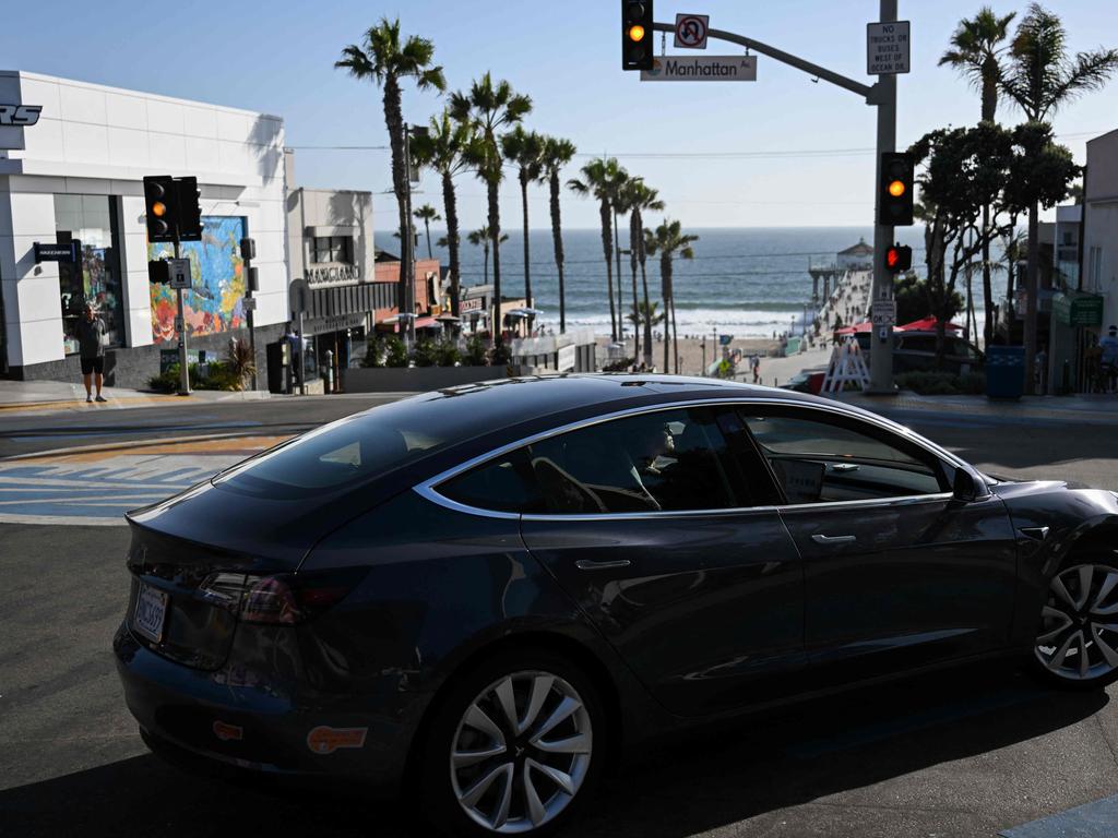 Unlike the US, EU and Japan, Australia does not require EVs to emit any sound when travelling at low speeds. Picture: Patrick T. Fallon / AFP