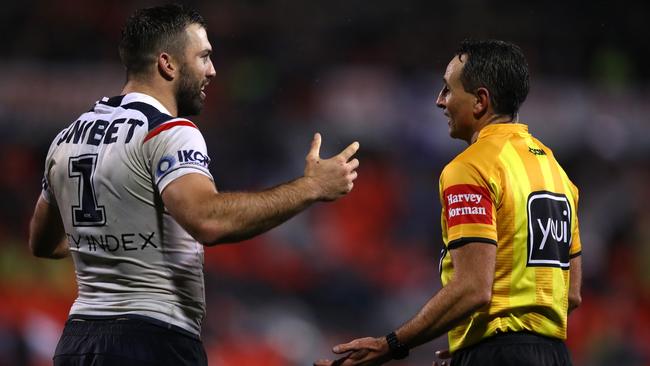 James Tedesco and referee Gerard Sutton. Picture: Jason McCawley/Getty