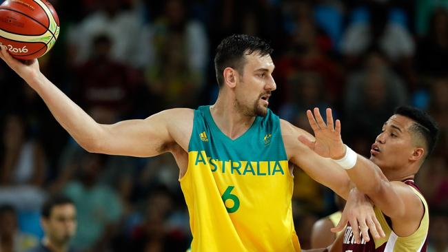 Andrew Bogut of Australia controls the ball as Windi Graterol of Venezuela defends during the preliminary round game at the Rio 2016 Olympic Games.