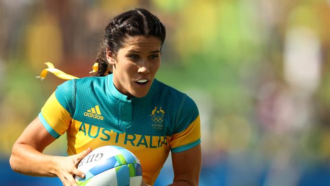 RIO DE JANEIRO, BRAZIL - AUGUST 06: Charlotte Caslick of Australia runs with the ball during the Women's Pool A rugby match between Ausutralia and Colombia on Day 1 of the Rio 2016 Olympic Games at Deodoro Stadium on August 6, 2016 in Rio de Janeiro, Brazil. (Photo by Mark Kolbe/Getty Images)