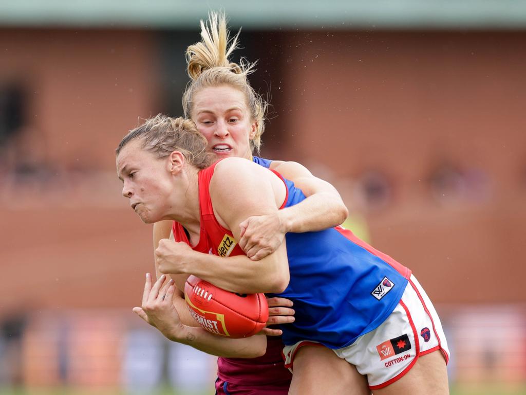 Maddison Gay of the Demons is tackled by Isabel Dawes of the Lions during the 2022 AFLW Season 7 Grand Final match between the Brisbane Lions and the Melbourne Demons at Brighton Homes Arena, Springfield, Ipswich on November 27, 2022 in Ipswich, Australia. (Photo by Russell Freeman/AFL Photos via Getty Images)