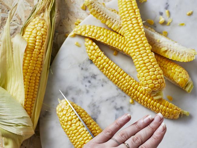 Cut the corn lengthways to make the ribs. Picture: Guy Bailey