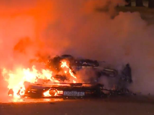 Firebombed … the Lamborghini Huracan in flames at Olympic Park. Picture: 9News