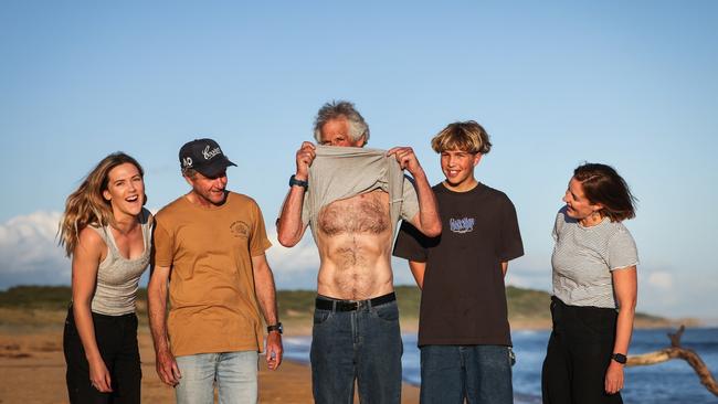 Rescuers with Garry a year after helping save the surfer’s life. Picture: Nicole Cleary