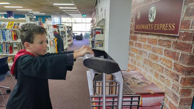 Young Alex Leonard-Kyel, pictured here in a Harry Potter costume, is a regular mobile library visitor.