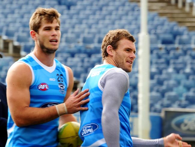 Cameron Mooney (right) knew Tom Hawkins’ time upfront for the Cats had come.