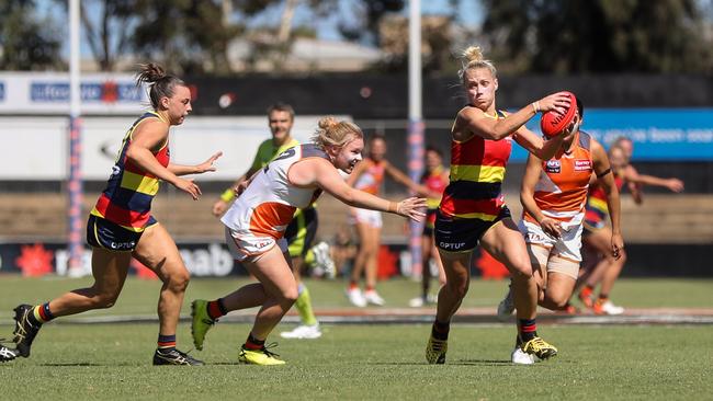 Erin Phillips, right, of the Crows evades Tait Mackrill of the Giants during the 2020 AFLW Round 6 match between Adelaide and GWS at Hisense Stadium on March 15, 2020. Picture: MATT TURNER/AFL PHOTOS VIA GETTY IMAGES