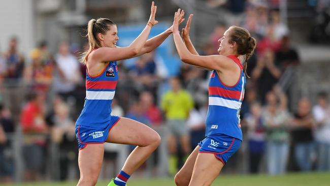 Ellyse Gamble and captain Katie Brennan, who will miss Saturday night with injury, celebrate a goal during the loss to Adelaide last weekend.