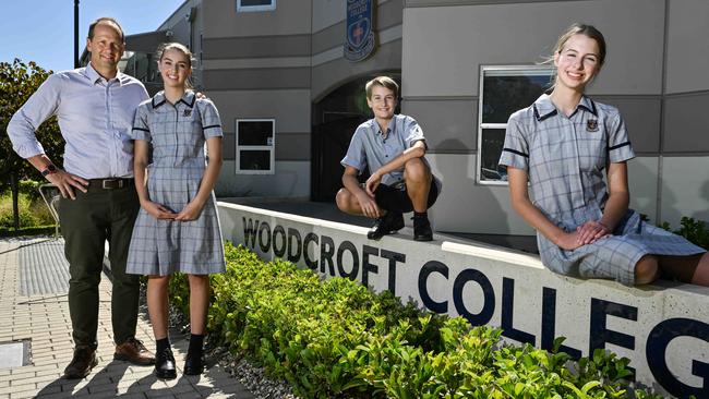 Marty Fox teaches at Woodcroft College, with his children Elsa, Maxwell and Zara. Picture: Brenton Edwards