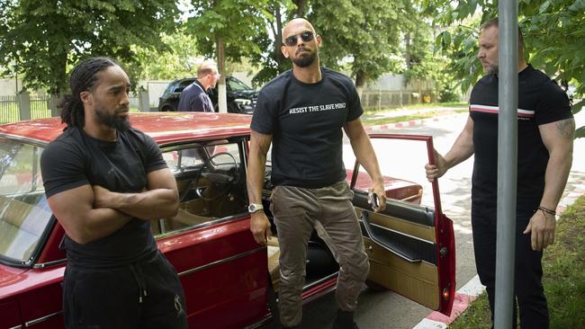 Andrew Tate arrives at a police station in a Lada vehicle in Voluntari on May 21. Picture: AP Photo/Vadim Ghirda