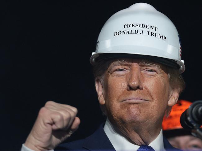 LATROBE, PENNSYLVANIA - OCTOBER 19: Republican presidential nominee, former U.S. President Donald Trump, wears a hard hat given to him by steelworker during a campaign rally on October 19, 2024, in Latrobe, Pennsylvania. There are 17 days remaining until the U.S. presidential election, which will take place on Tuesday, November 5, 2024.   Win McNamee/Getty Images/AFP (Photo by WIN MCNAMEE / GETTY IMAGES NORTH AMERICA / Getty Images via AFP)