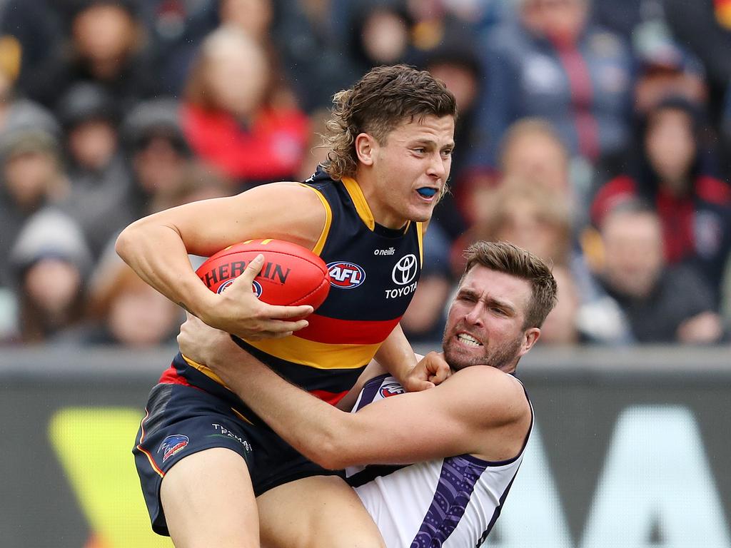 ADELAIDE - APRIL 08: Jake Soligo of the Crows and Luke Ryan of the Dockers during the 2023 AFL Round 04 match between the Adelaide Crows and the Fremantle Dockers at Adelaide Oval on April 8, 2023 in Adelaide, Australia. (Photo by Sarah Reed/AFL Photos via Getty Images)