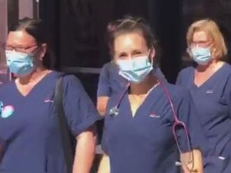 Video still from Facebook of striking Blacktown Hospital nurses walking off the job today. Source: Facebook - https://www.facebook.com/nswnma/videos/391228402067419