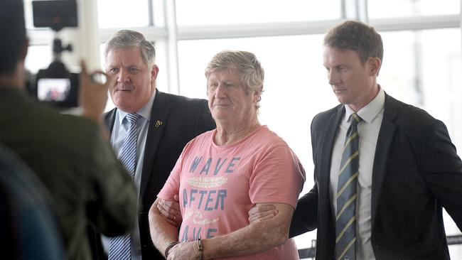 Retired homicide cop Russell Oxford (far left) arrests wife-killer John Bowie in 2019. Picture: Jeremy Piper