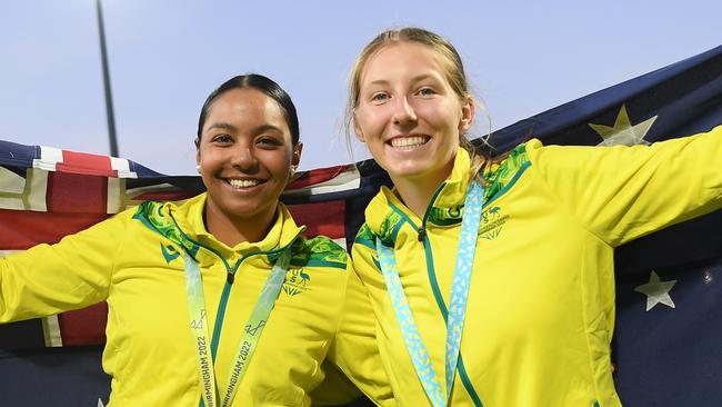 BIRMINGHAM, ENGLAND - AUGUST 07: Alana King and Darcie Brown of Team Australia celebrate after being presented with the Gold Medal following the Cricket T20 - Gold Medal match between Team Australia and Team India on day ten of the Birmingham 2022 Commonwealth Games at Edgbaston on August 07, 2022 on the Birmingham, England.  (Photo by Alex Davidson/Getty Images)