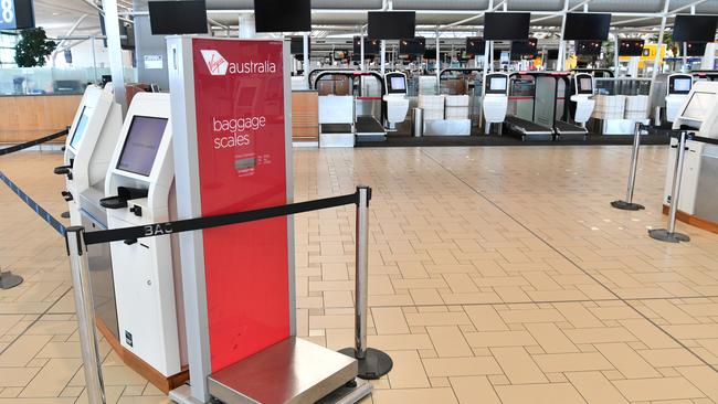 Empty Virgin Australia check-in counters Brisbane International Airport. Picture: AAP