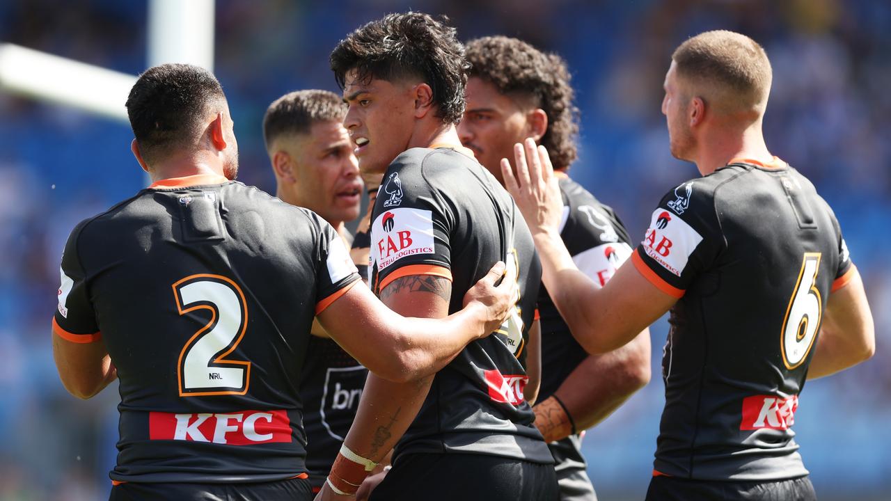 Tommy Talau celebrates scoring a try with his Tigers teammates. Picture: Getty Images