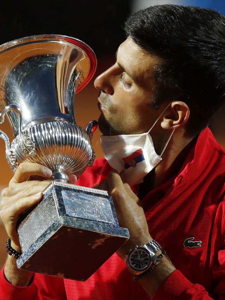 Novak Djokovic celebrates with trophy after winning his men's final match against Diego Schwartzman . (Photo by Clive Brunskill/Getty Images)