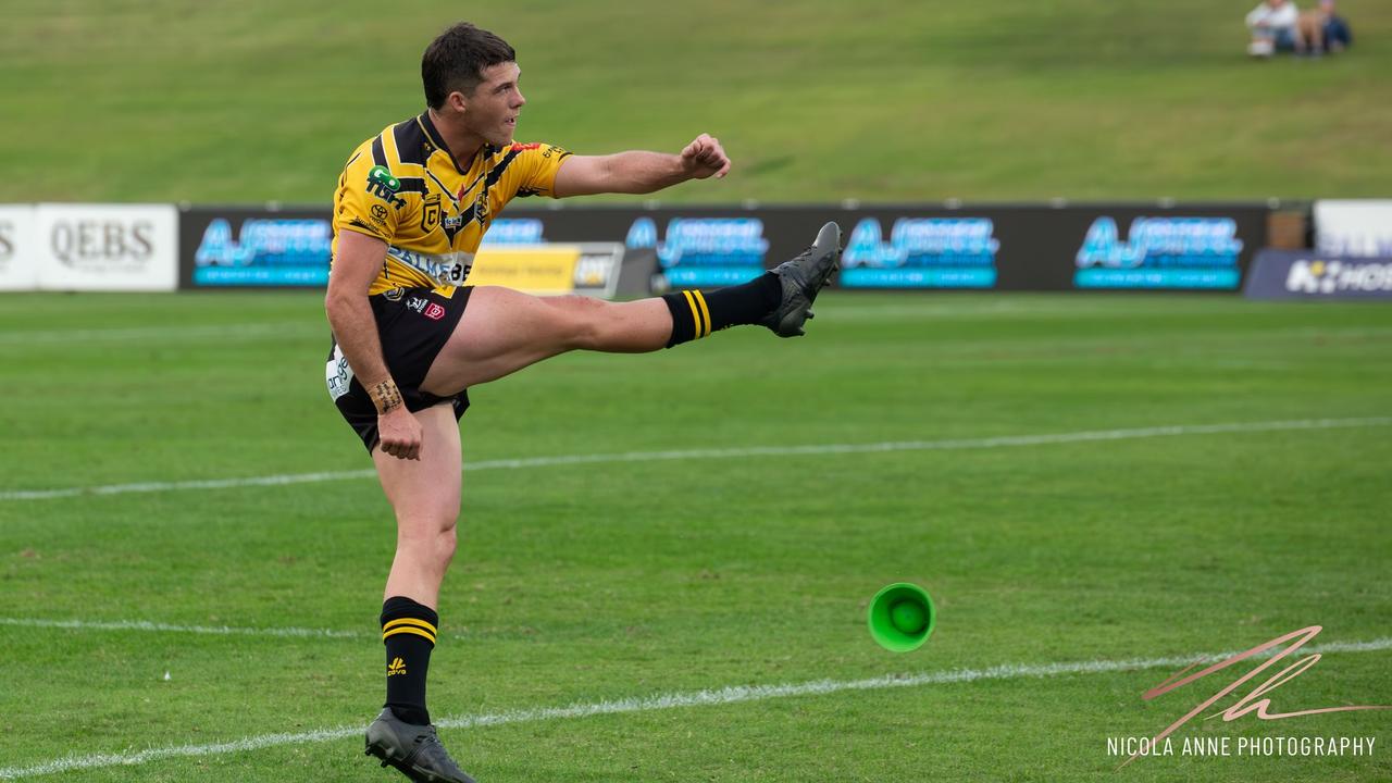 Sunshine Coast Falcons player Corey Herdegen kicks for goal. Picture: Nicola Anne Photography