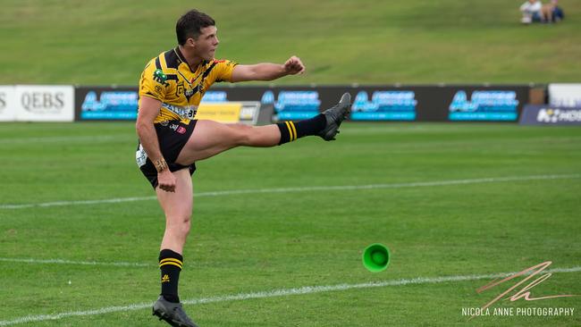 Sunshine Coast Falcons player Corey Herdegen kicks for goal. Picture: Nicola Anne Photography