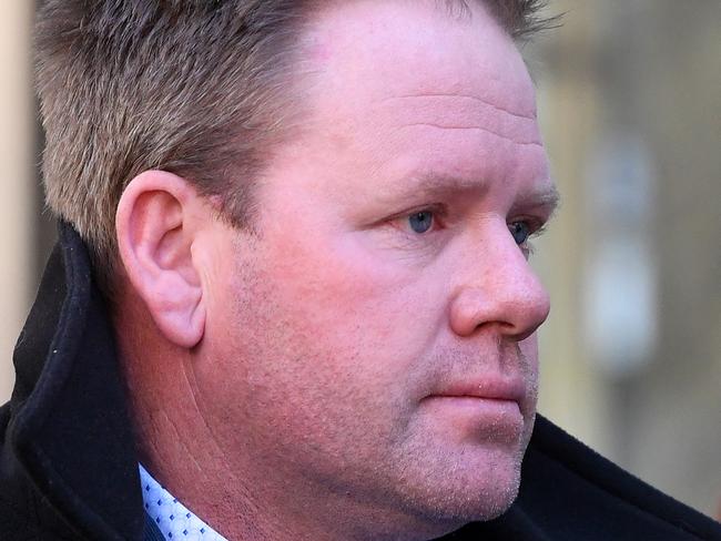 Nick Stevens departs the County Court of Victoria, Melbourne, Monday, July 22, 2019. The former AFL star faces perjury charges after allegedly giving false evidence in Ringwood Magistrates Court in December 2014. (AAP Image/James Ross) NO ARCHIVING