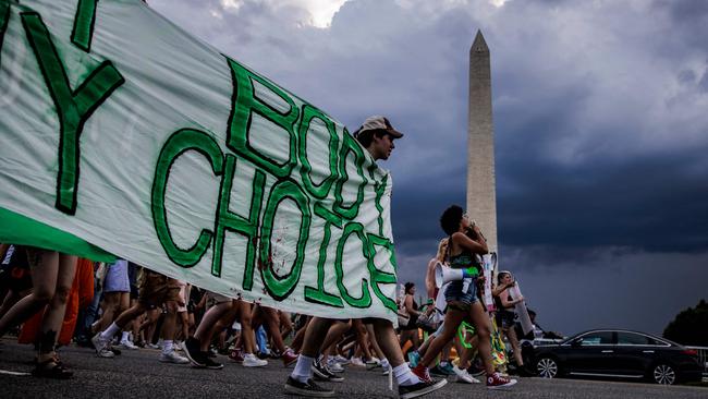 Abortion rights activists march past the Washington Monument as they protest in Washington after the US Supreme Court’s decision to scrap abortion rights. Picture: Samuel Corum / AFP