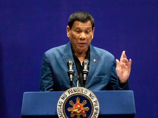 Former Philippines president Rodrigo Duterte was arrested Tuesday in Manila by police acting on an International Criminal Court warrant tied to his deadly war on drugs. / AFP PHOTO / ISAAC LAWRENCE