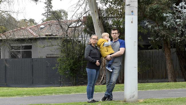 Peter Horak with his wife Magda and son Adam outside their home in Camberwell. Picture: Andy Brownbill