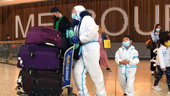 An international traveller in full PPE gear arrives at Melbourne Airport. Picture: AFP