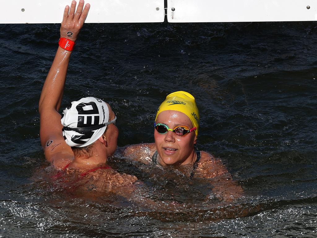 Sharon van Rouwendaal of Team Netherlands touches the finish to win gold after Australia’s Moesha Johnson led for the best part of 6km and finished with silver. Picture: Clive Rose/Getty Images