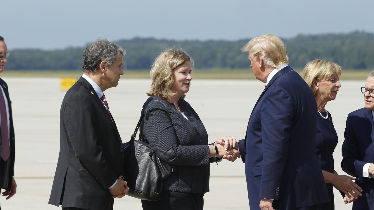 President Donald Trump greets Dayton Mayor Nan Whaley at Wright Patterson Air Force Base, Wednesday, Aug. 7, 2019, in Dayton, Ohio. Picture: Ty Greenlees/Dayton Daily News via AP.