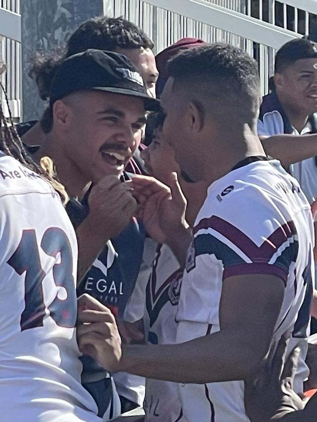 Ipswich SHS's Gabriel Satrick is congratulated, with Jack Laing on the left.