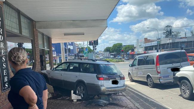 A man in his 70s is in hospital after hitting the accelerator instead of his brakes, crashing into two other cars and a business in the Gold Coast hinterland. Photo: Facebook.