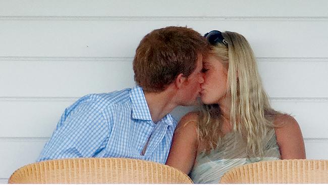 Prince Harry and Chelsy Davy kiss in the Royal Box as they attend the Cartier International Polo Match in 2006. (Photo by Max Mumby/Indigo/Getty Images)