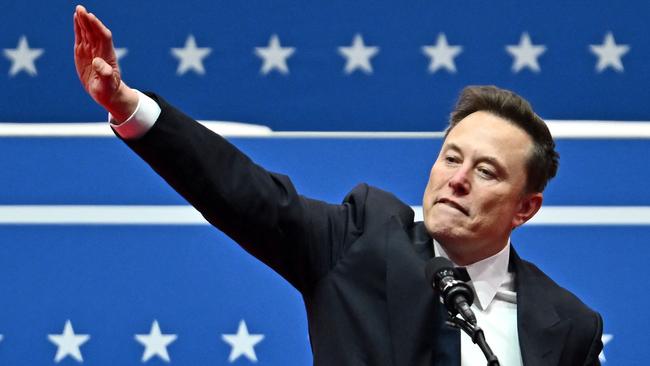 Tesla and SpaceX CEO Elon Musk gestures as he speaks during the inaugural parade inside Capitol One Arena, in Washington, DC, on January 20, 2025. (Photo by ANGELA WEISS / AFP)