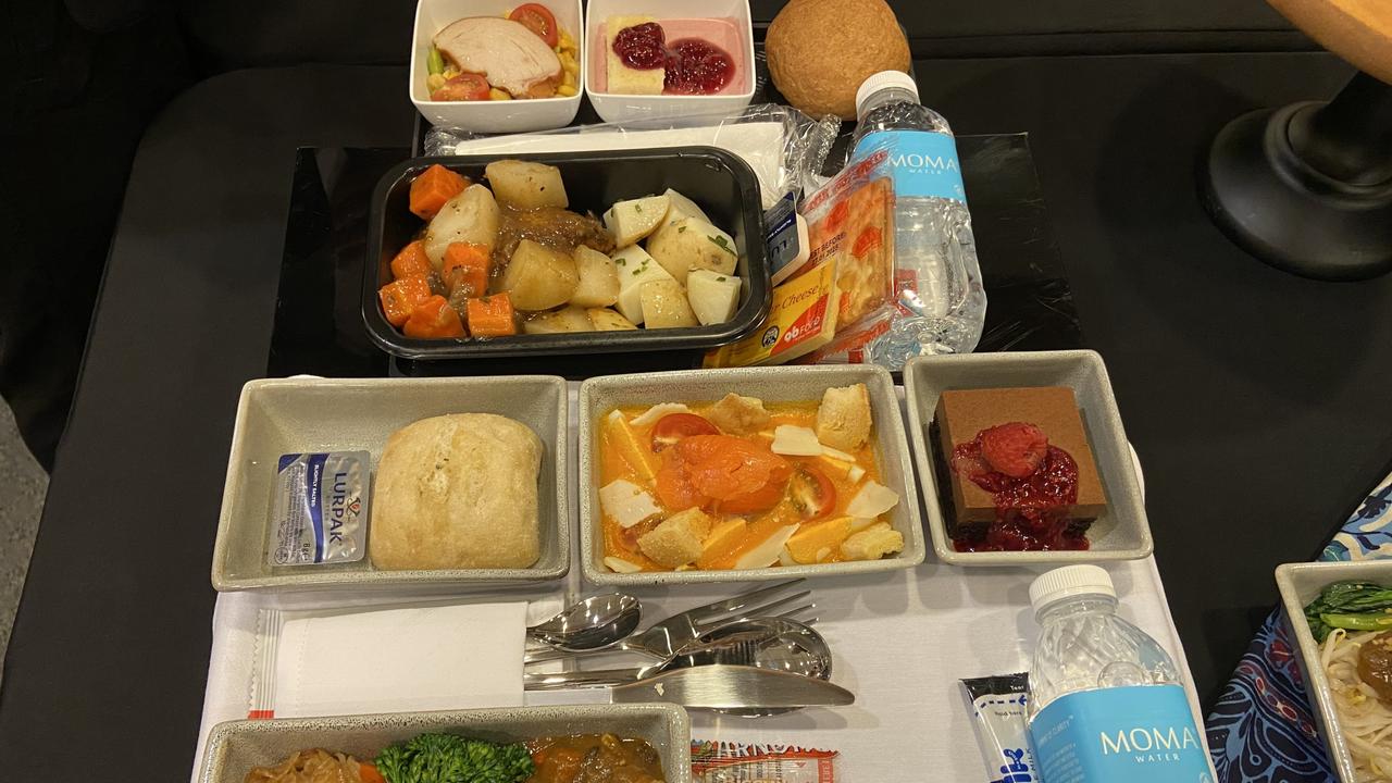 Comparison between current premium economy service tray (top) and new offering (bottom).