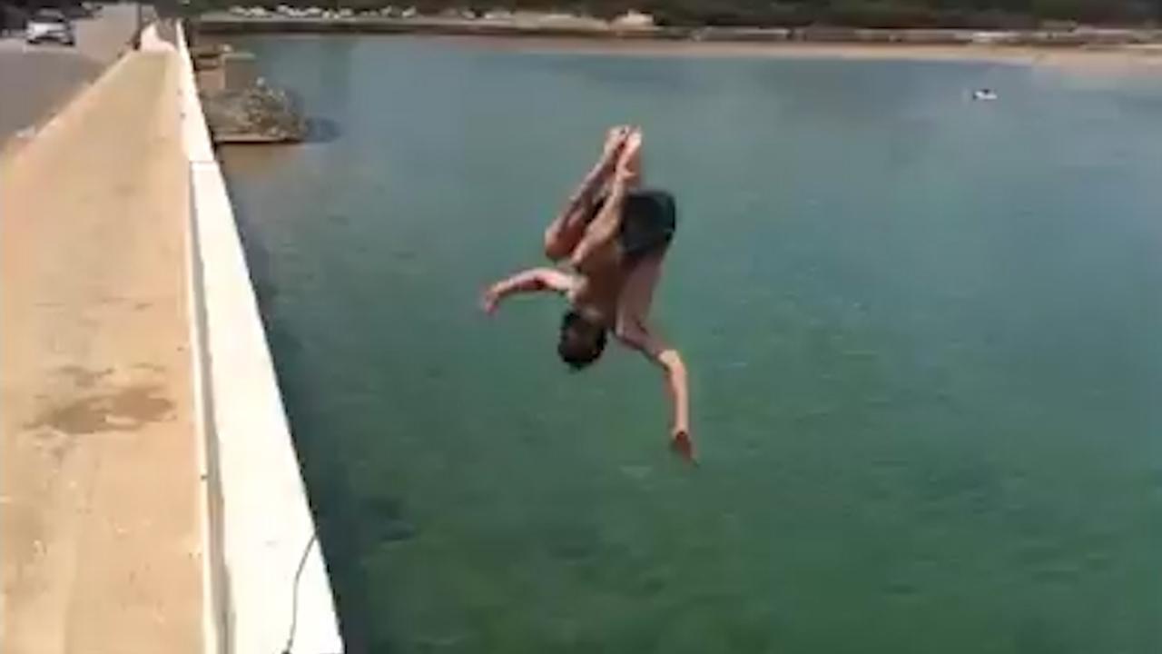 Daredevil jumping off bridge in Narrabeen