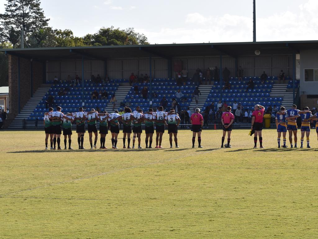 Marist Brothers and Northern United hold a minute silence before the game.