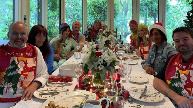 John Farnham, at the head of the table, celebrates Christmas with his family. Picture: Instagram