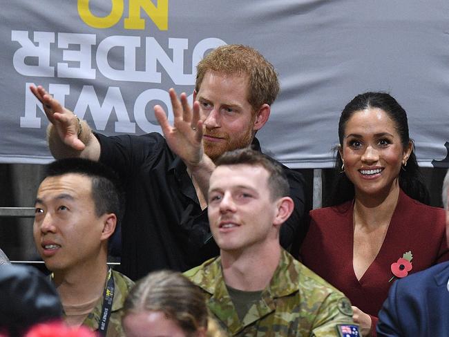 Britain's Prince Harry, the Duke of Sussex and his wife Meghan, the Duchess of Sussex are seen during the Wheelchair Basketball Final at the Invictus Games in Sydney. Picture: AAP