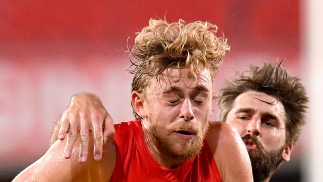 Hugh Greenwood is wrapped up by Justin Westhoff. Picture: AAP Image/Darren England.