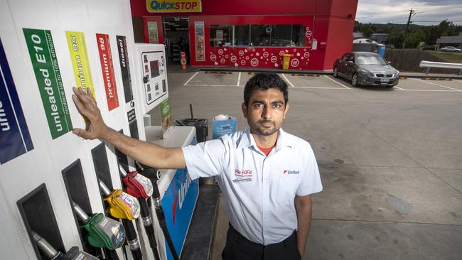 Patel standing by one of his fuel pumps. Picture: David Geraghty