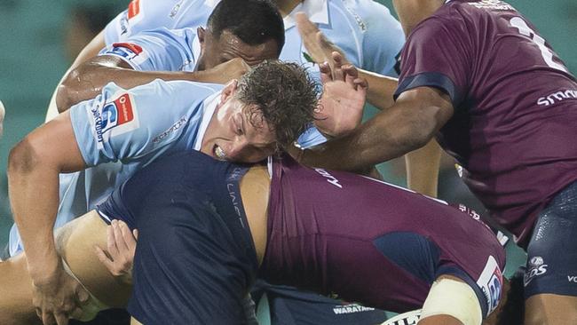 Michael Hooper drives Lukhan Salakaia-Loto into the turf in another display of the Waratahs strong defence. Picture: AAP Image/Craig Golding