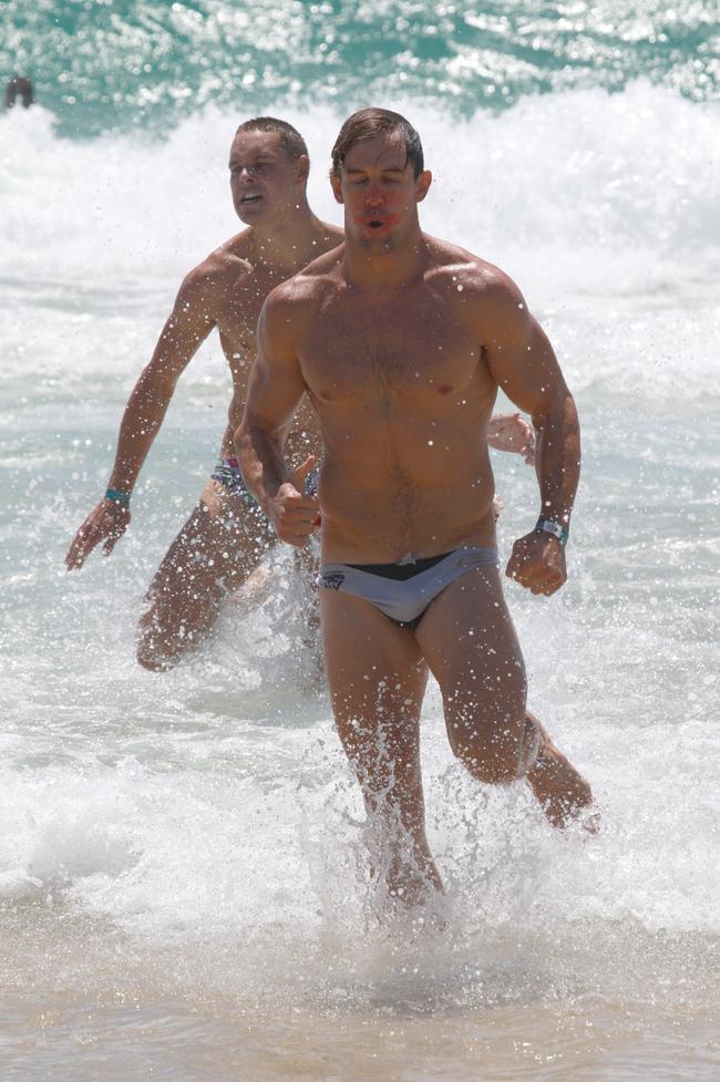 Oliver Burrows-Cheng running out of the water during the Southport Sharks VFL team’s preseason training camp at Tallebudgera Beach. Picture: Mike Batterham