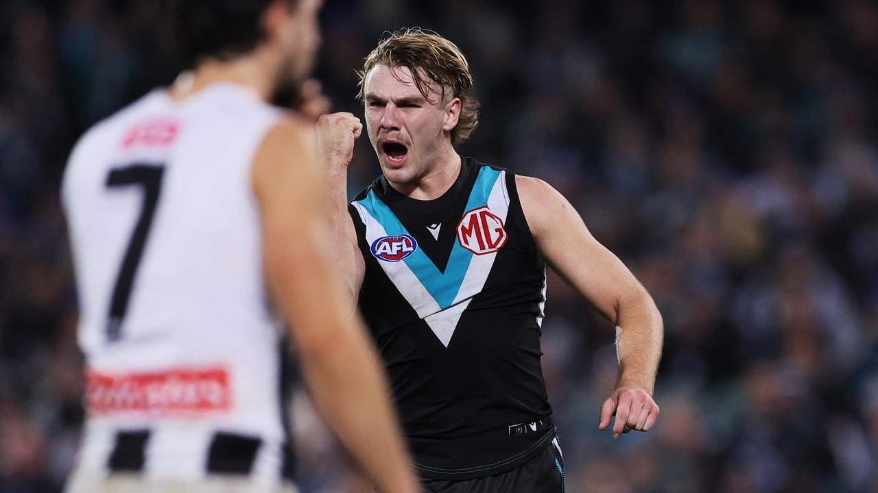 Jason Horne-Francis celebrates a goal after chasing down Magpie Brayden Maynard. Picture: James Elsby/AFL Photos