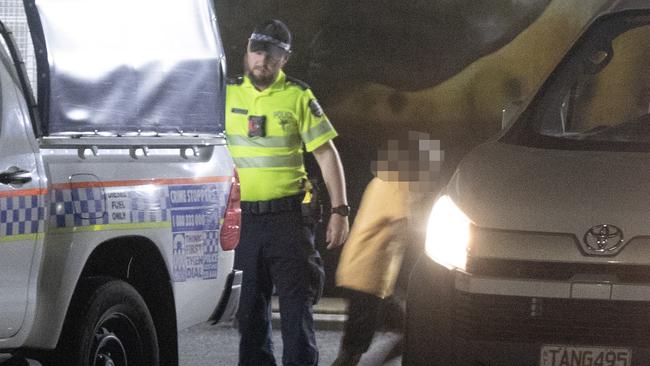 A young Indigenous Australian is released from a police cage truck and enters a local youth organisation vehicle to be returned to a town camp in Alice Springs. Picture: Liam Mendes / The Australian